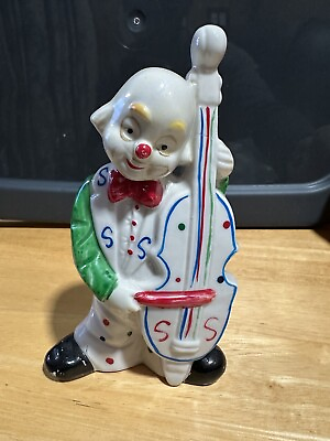 #ad vintage figurine of Porcelain white clown playing the bass cello $25.00