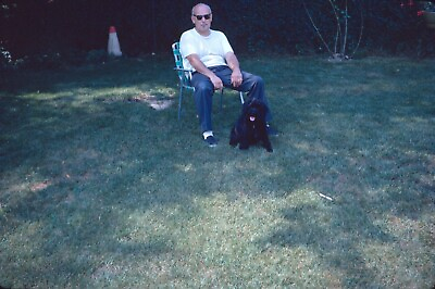 1972 Man Smoking Sitting Lawn Chair Petting Black Dog 70s Vintage 35mm Slide $10.00