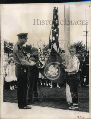 #ad 1957 Press Photo Officer L.N. Frederick and a pupils take down Elmer Safety Flag $29.88