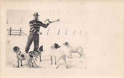 #ad J72 Interesting RPPC Postcard c1910 Man Feeding Dogs Pets Snow 423 $13.80